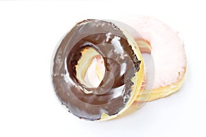 Chocolate and strawberry cream donuts on white background