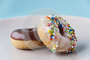 Chocolate and sugar donuts photo