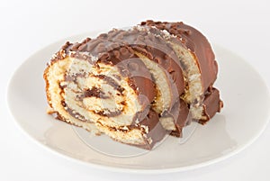 Chocolate swiss roll on a plate