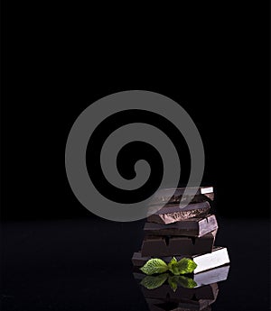 Chocolate tablets on black background. photo