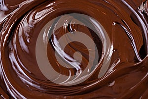 Chocolate texture. Liquid chocolate close-up.Textured dark chocolate