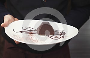 Chocolate truffle cake in pyramid shape