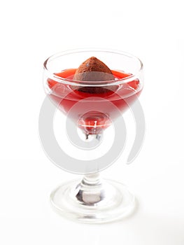 Chocolate truffle in fruit coulis photo