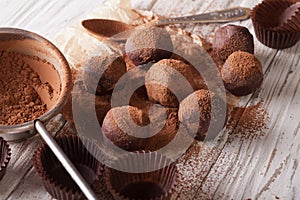 Chocolate truffles sprinkled with cocoa powder close-up. horizon photo