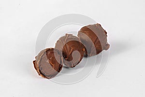 Chocolate truffles on white background