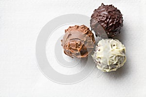 Chocolate truffles on white tablecloth