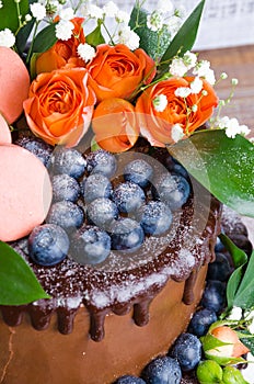 Chocolate two layered wedding cake with roses