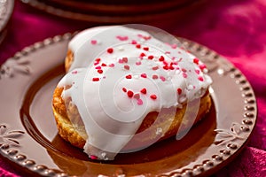 Chocolate and vanilla heart shaped donuts stacked