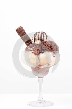 Chocolate and vanilla ice cream in cup on white background.