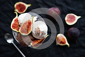 Chocolate and vanilla ice cream scoops with fig pieces