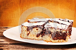 Chocolate and vanilla sponge cake served on a plate