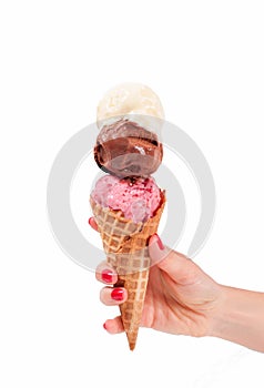 Chocolate, vanilla and strawberry ice cream cone on white background