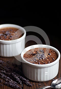 Chocolate vegan dessert - aquafaba mousse - egg free, non-dairy cocoa pudding or souffle on dark moody background