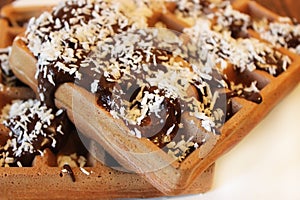 Chocolate wafer with chocolate and coconut close up, captured with a small depth of field