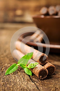 Chocolate wafer rolls with mint close-up