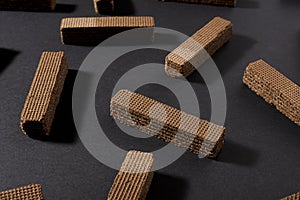 Chocolate wafers on black background