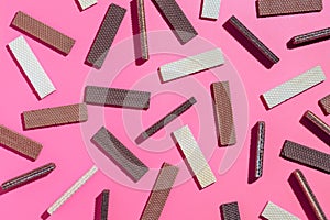 Chocolate wafers on pink  background