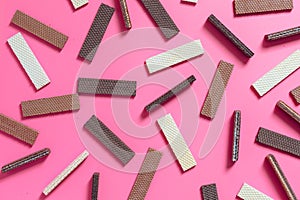 Chocolate wafers on pink background