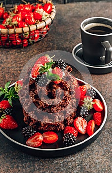 Chocolate waffles with milk and berries for breakfast. Chocolate cookies amerikaner shaped waffles photo