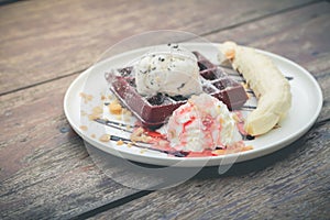 chocolate waffles with vanilla ice cream, banana, whipped cream