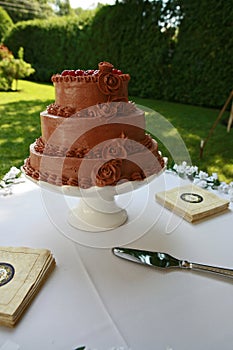 Chocolate wedding cake on table