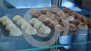 Chocolate and white chocolate candies in shop window