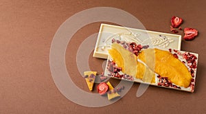 Chocolate white fruit whole tile decorated with slices of fruit nuts