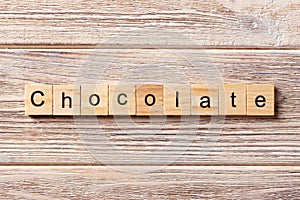 Chocolate word written on wood block. Chocolate text on table, concept
