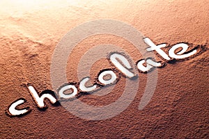 Chocolate written with cocoa powder