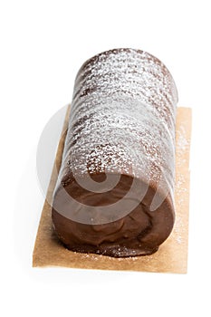 Chocolate yule log christmas cake coated with milk chocolate isolated on white