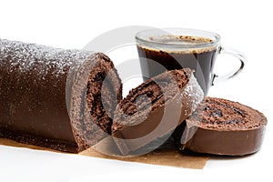 Chocolate yule log christmas cake with cup of coffee isolated on white