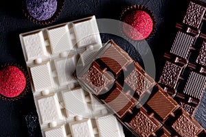 Chocolates background. Chocolate. Assortment of fine chocolates in white, dark, and milk chocolate. Praline Chocolate