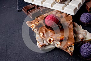 Chocolates background. Chocolate. Assortment of fine chocolates in white, dark, and milk chocolate. Praline Chocolate
