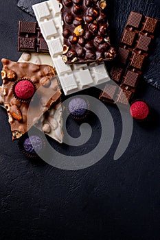 Chocolates background. Chocolate. Assortment of fine chocolates in white, dark, and milk chocolate. Praline Chocolate