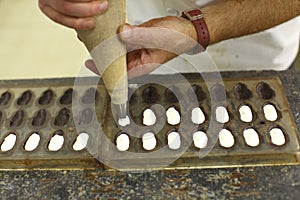 Chocolatier making praline