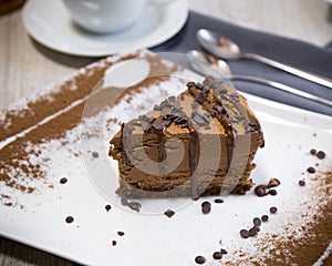 A chocolaty dessert with a delicate biscuit and a souffle melting in the mouth.