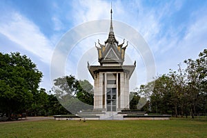 Choeung Ek Genocidal Center under a blue cloudy sky in Phnom Penh, Cambodia