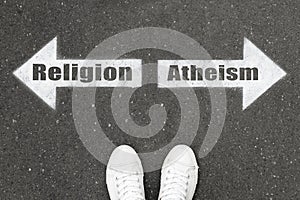 Choice between atheism and religion. Woman standing on road near arrows marking, top view