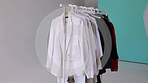 A choice of clothes on a rack. Wardrobe rack with stylish clothes