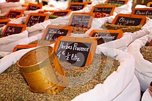 Choice of French spices herbes de Provence in white bags. Name of spice is written on small chalkboards. St. Tropez, France