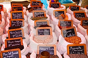 Choice of French spices herbes de Provence in white bags. Name of spice is written on small chalkboards. St. Tropez, France