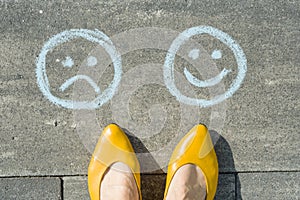 Choice - Happy Smileys or Unhappy, text on asphalt road