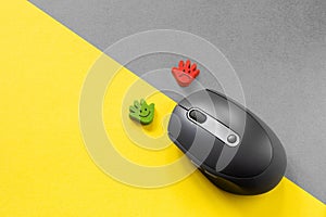 The choice between joy and sadness, positive and negative. PC mouse as a symbol of choice