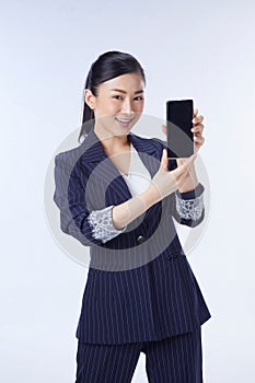 Choice it! Technology, mobile, equipment for communication. Young beautiful woman shows right in camera the blank screen of smart