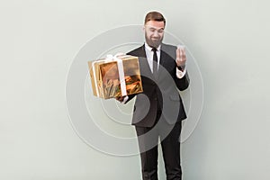 Choise concept. Businessman holding different boxes. Studio shot