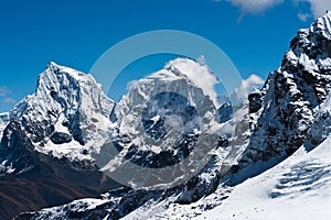 Cholatse and Taboche summits viewed from Renjo Pass photo
