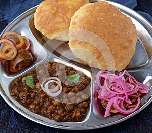 Chole bhature with pickled onions