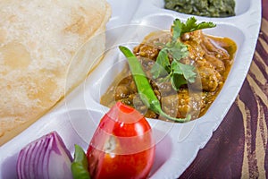 Chole bhature with salad and chutney