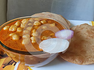 Chole Puri dish in a plate. Chole Poori receipe in a plate. Chickpeas receipe in a plate.