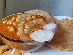 Chole Puri dish in a plate. Chole Poori receipe in a plate. Chickpeas receipe in a plate. photo